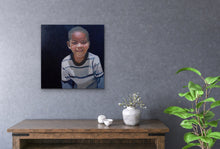 Load image into Gallery viewer, Mock up of original oil painting of smiling african boy in living space